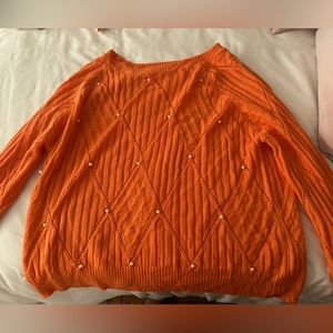 Orange sweater with pearls